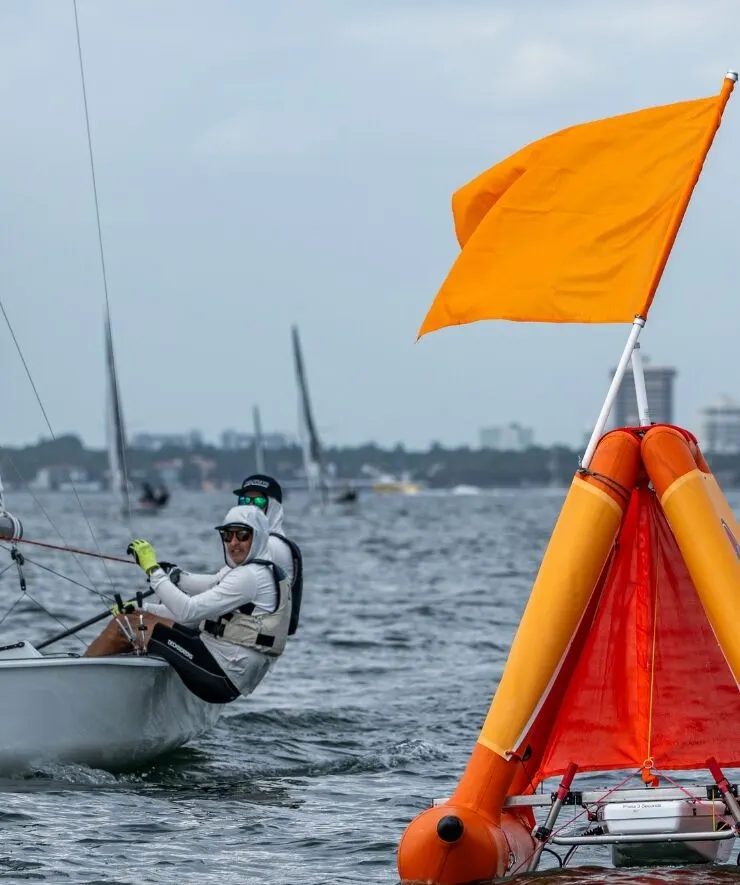 A RoboMark holds position as a dinghy races past